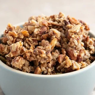 Crunchy low carb keto granola with golden toasted coconut flakes, pecans, almonds, and pumpkin seeds.