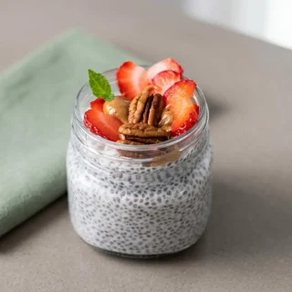 Creamy keto chia pudding recipe served cold in a glass jar with a smooth, gelled texture.