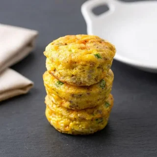 Fluffy keto egg muffins baked to a perfect golden brown in a muffin pan.