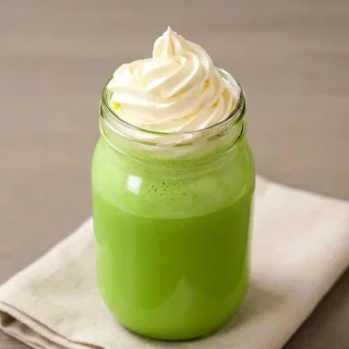 A fluffy bowl of sugar-free keto whipped cream showing a light and velvety texture.