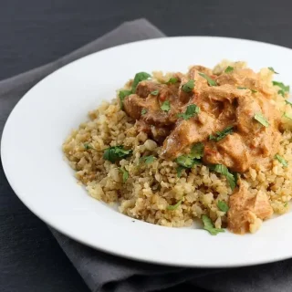 Creamy keto chicken tikka masala curry with tender chicken thighs in a rich, velvety orange sauce.