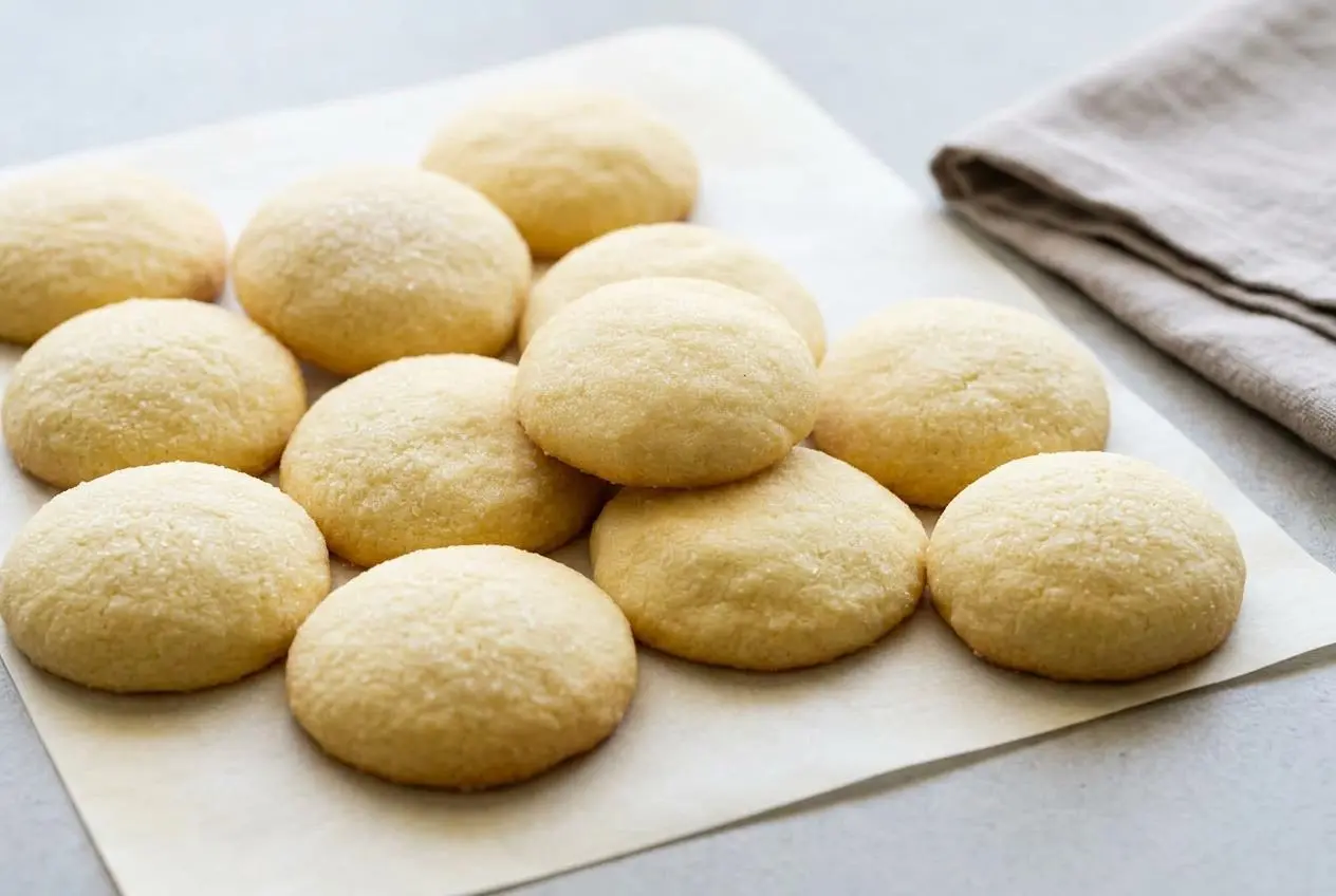 Keto sugar cookies recipe cutouts baked to a light golden edge with a delicate granulated sweetener crust
